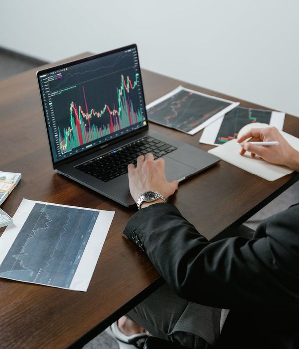 Business analyst reviewing financial charts and performance metrics