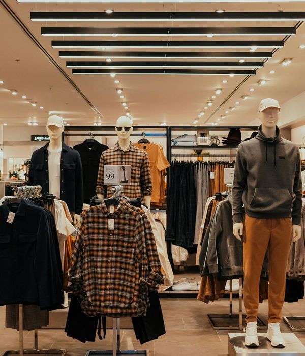 Contemporary retail space with organized product displays and shoppers